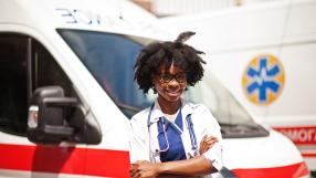 Health Worker in front of ambulance