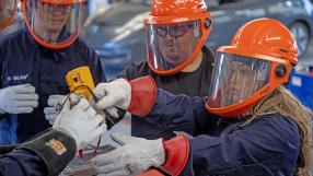 Lucy Amorette, right, tests a battery cell with fellow students, Will Rivas, center, and Christopher Mondragon, far left, at Pueblo Community College Electric Vehicle service class in Pueblo on Thursday, February 19, 2026. (The Gazette, Michael G. Seamans)