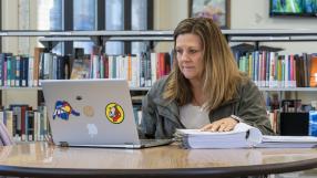 Lana Manchego at a laptop in the PCC Library