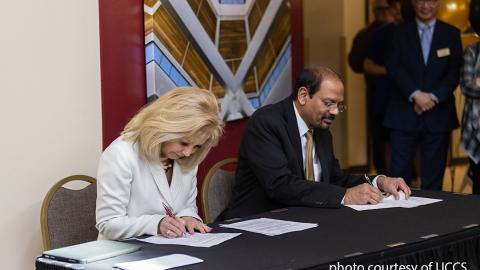 UCCS Chancellor Reddy and PCC President Erjavec signing a memorandum of understanding (MOU).