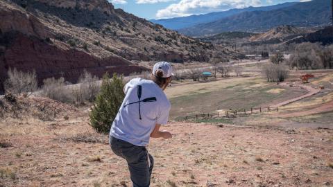 Player on the Fremont Campus Disc Golf Course