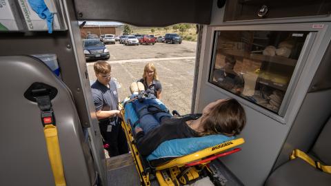 PCC EMT students loading patient into ambulance