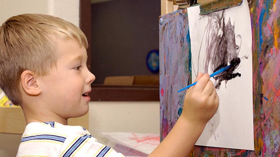 Young boy painting