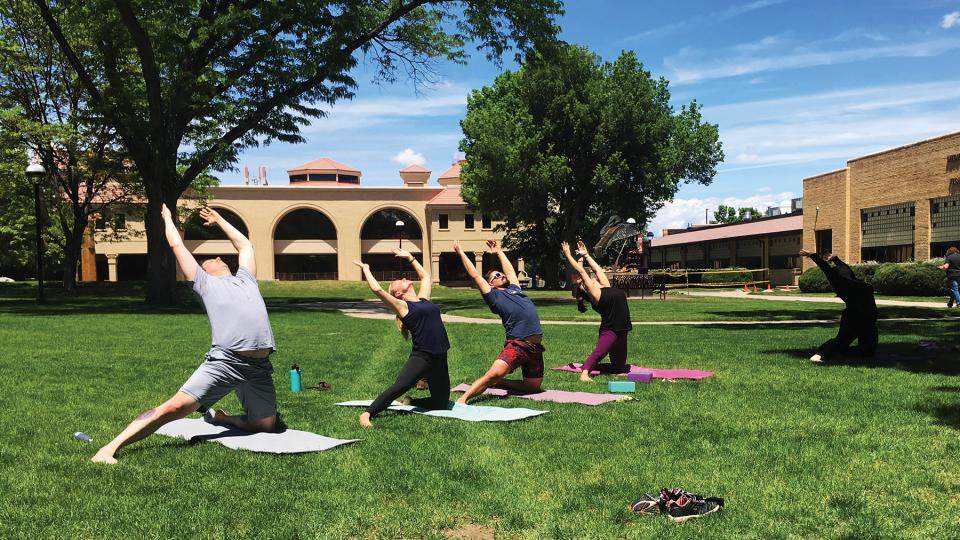 students participating in Yoga in the Courtyard