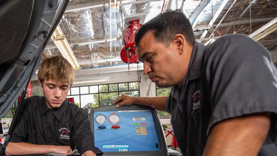 James Cordova with student in PCC's auto body shop