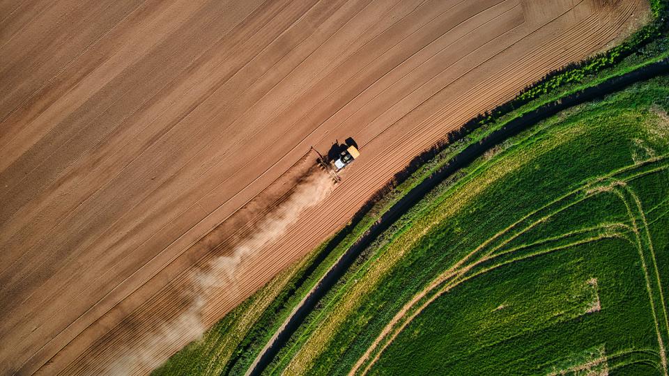 Tractor plowing a field