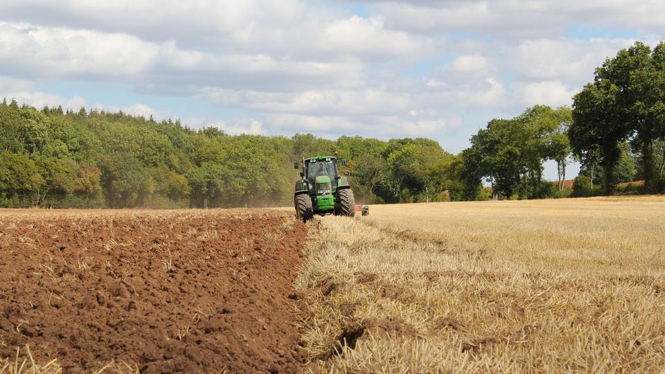 Tractor plowing a field