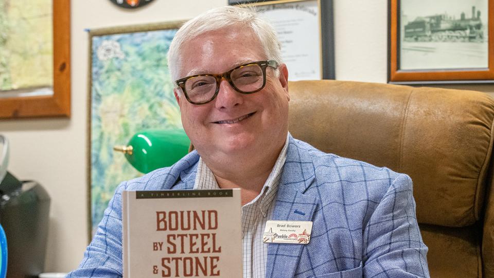Brad Bowers with book: “Bound by Steel & Stone”