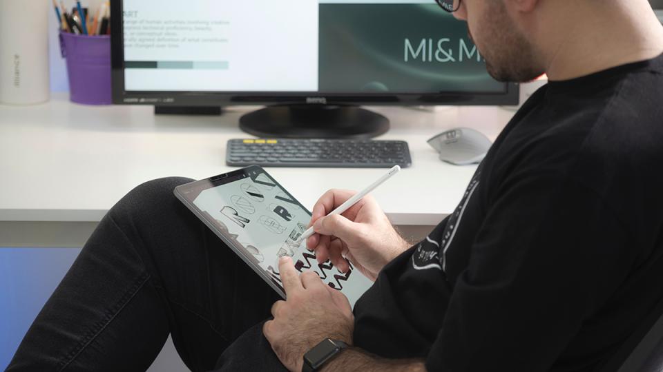 graphic designer using tablet and stylus