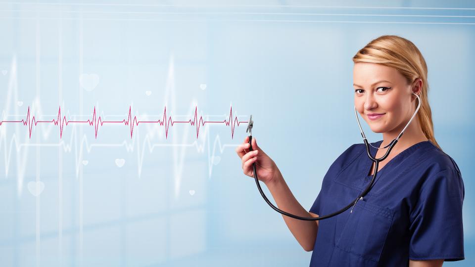 Clinic nurse next to heart rate graphic