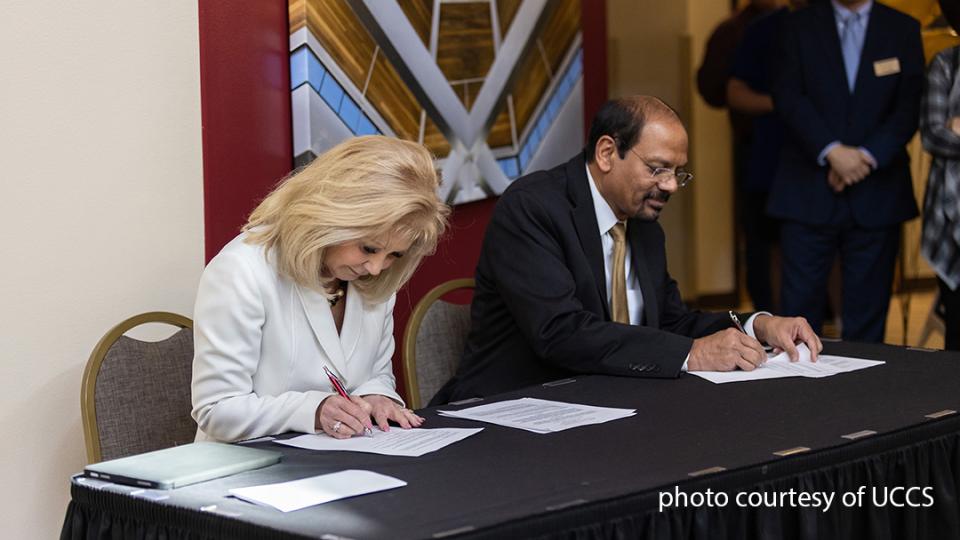UCCS Chancellor Reddy and PCC President Erjavec signing a memorandum of understanding (MOU).