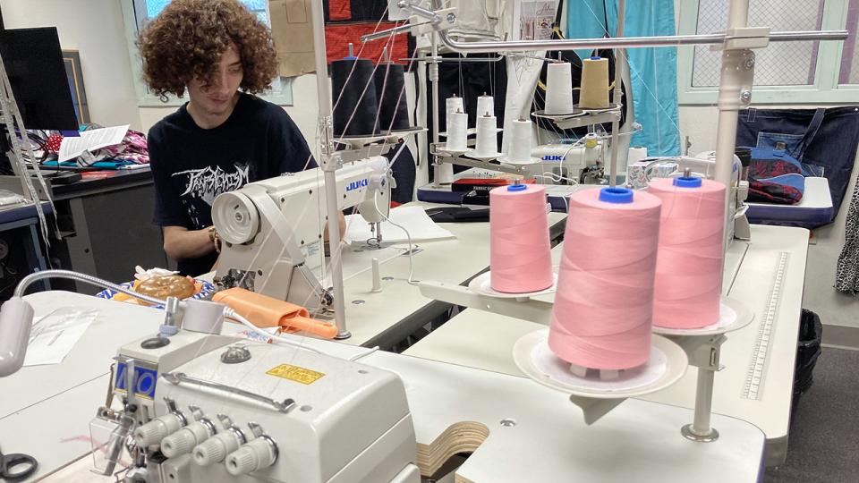 Student in Industrial Sewing class