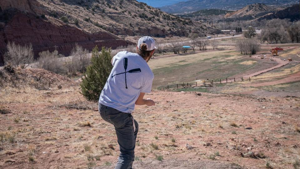 Player on the Fremont Campus Disc Golf Course