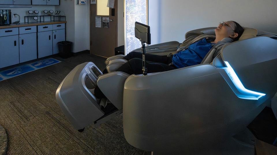 A student relaxing in the Zone Zone