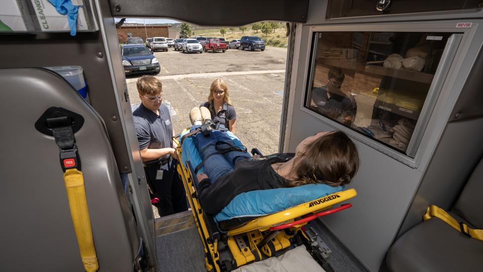 PCC EMT students loading patient into ambulance
