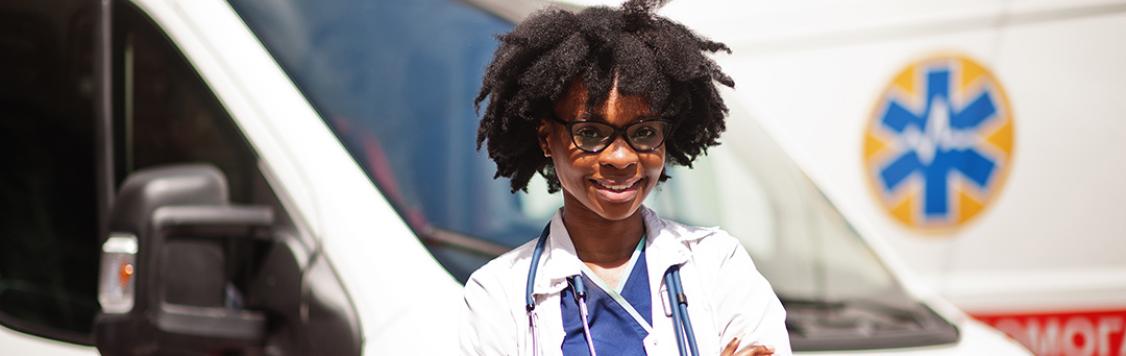 Health Worker in front of ambulance
