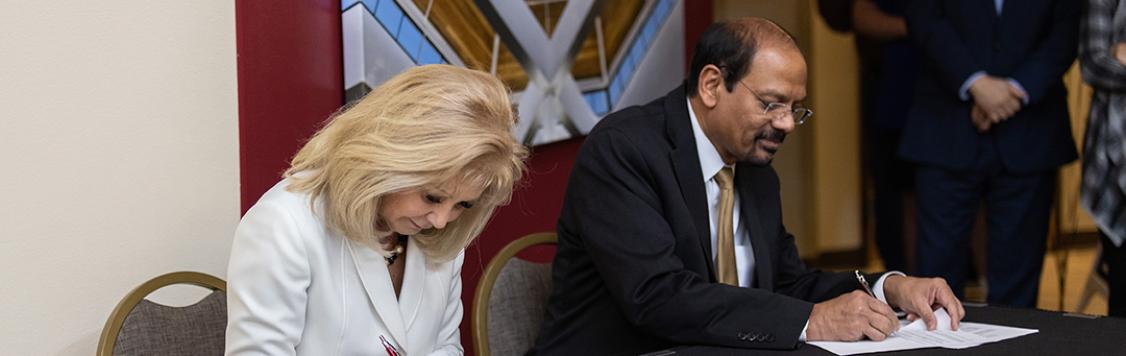 UCCS Chancellor Reddy and PCC President Erjavec signing a memorandum of understanding (MOU).