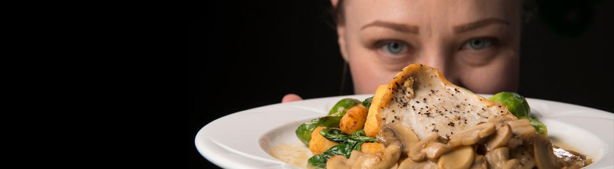 Chef, Mo Montgomery, with a culinary dish