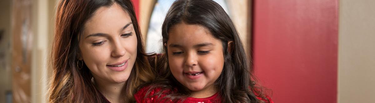 mother reading with her daughter