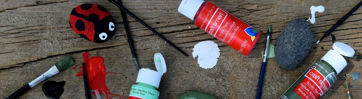 painted rocks, paint, and paint brushes