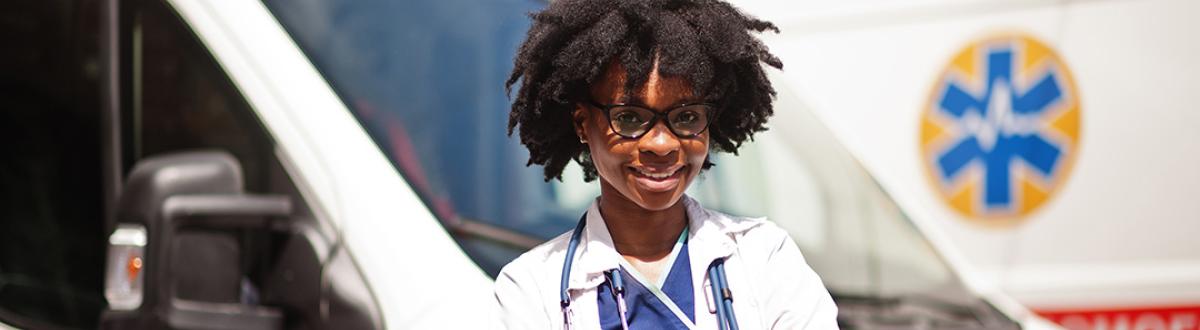 Health Worker in front of ambulance