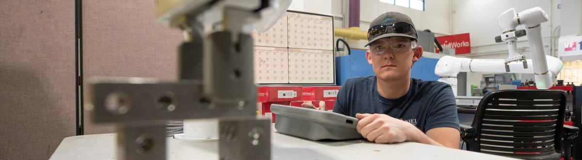 Machining student in lab
