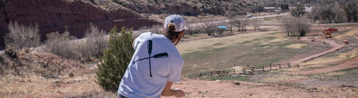 Player on the Fremont Campus Disc Golf Course