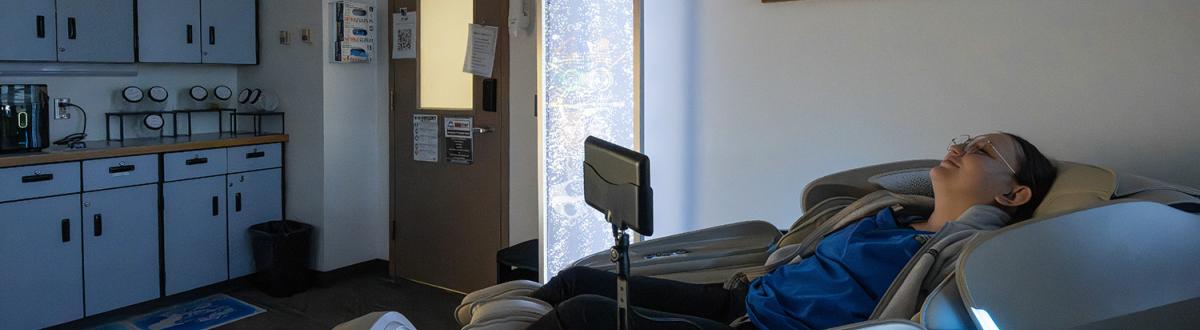 A student relaxing in the Zone Zone