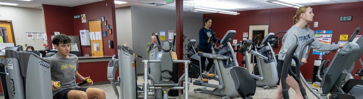 students using the fitness equipment inside the PCC Rec Center