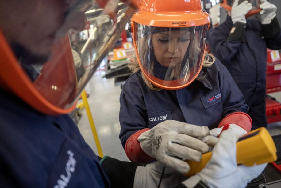 Lucy Amorette, right, tests a battery cell with fellow student, Will Rivas at Pueblo Community College’s electric vehicle service class in Pueblo on Thursday, February 19, 2026. (The Gazette, Michael G. Seamans)