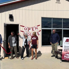 Kevin Aten, Chris LaRose and Melissa Watters cut the ribbon Tuesday morning at Pueblo Community College’s new STEM building. (Cameryn Cass/The Journal)