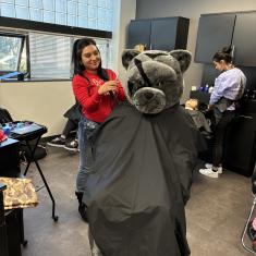 PCC Panther getting a haircut in the Cosmetology Clinic